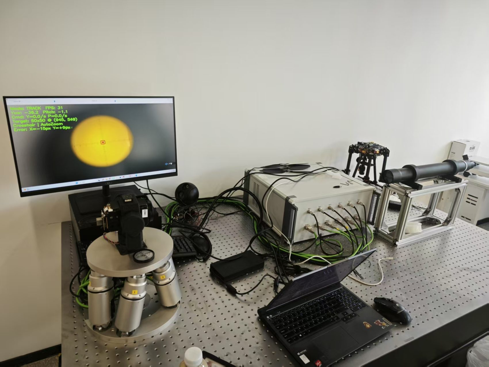 Optical tracking experiment bench with gimbal, target, and control hardware